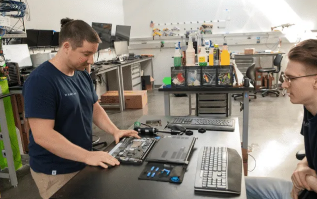 Hardware Service Technicians preparing devices for clients