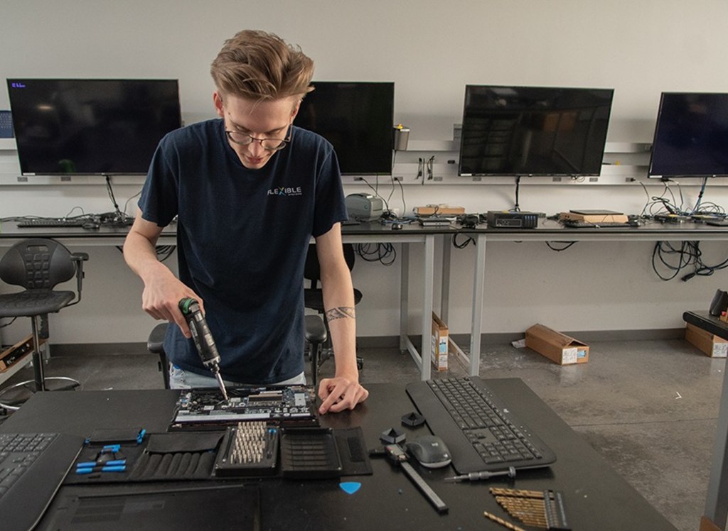 Flexible IT Specialist working on a laptop
